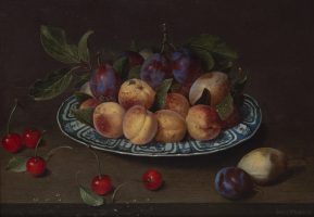 Platter of plums, peaches and pears with cherries on a table
